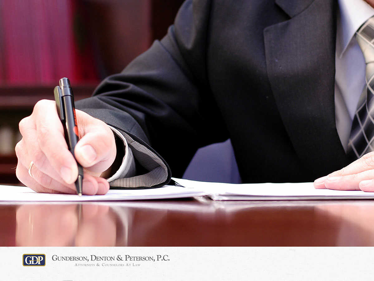Arizona Businessman Reviewing A Non-Compete Agreement During A Business Sale
